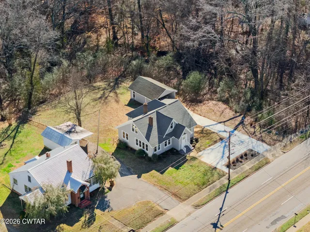 an aerial view of multi story residential apartment building with outdoor space