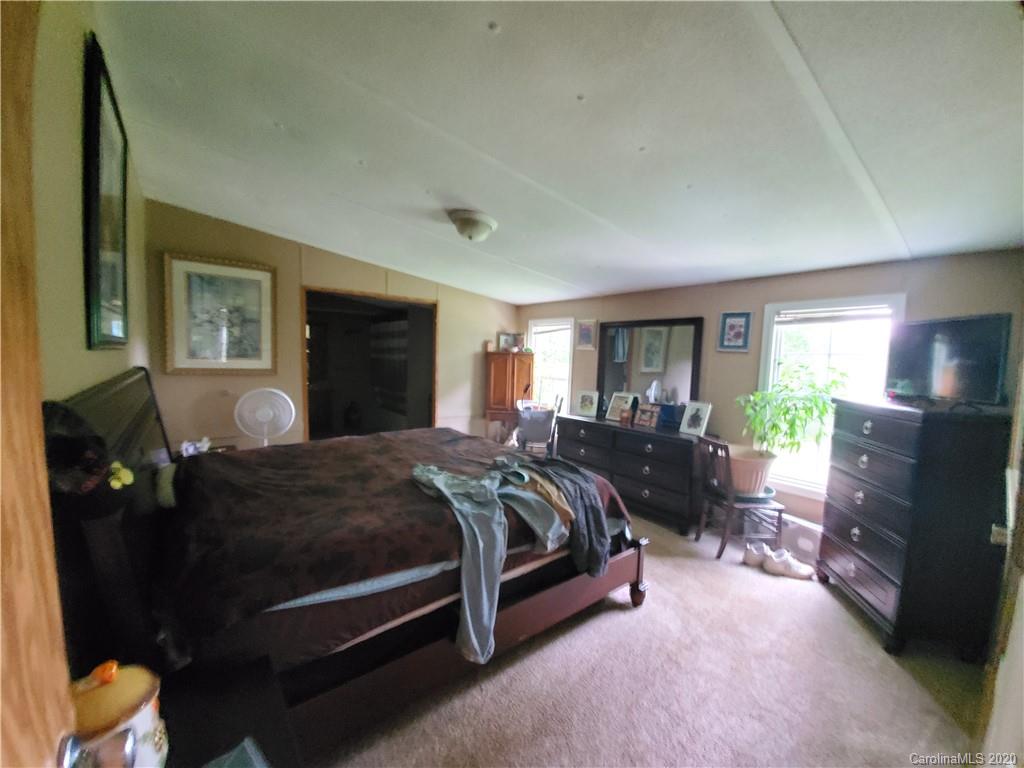 483 Freeman Road Forest City, NC 28043 - Photo 12 of 21 a bed room with a bed and potted plant