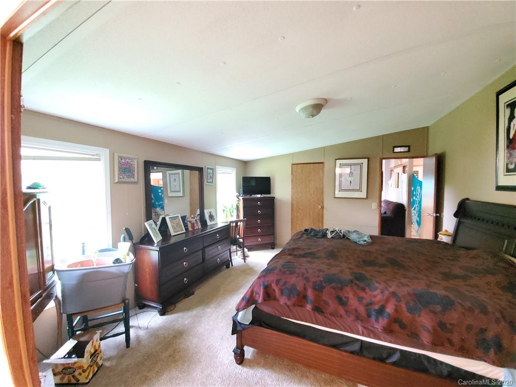 483 Freeman Road Forest City, NC 28043 - Photo 13 of 21 a bedroom with a bed and wooden floor