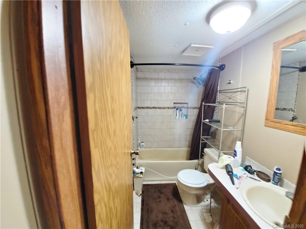 483 Freeman Road Forest City, NC 28043 - Photo 9 of 21 a bathroom with a sink toilet and shower