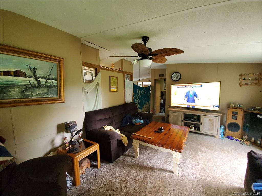 483 Freeman Road Forest City, NC 28043 - Photo 10 of 21 a living room with furniture and a flat screen tv