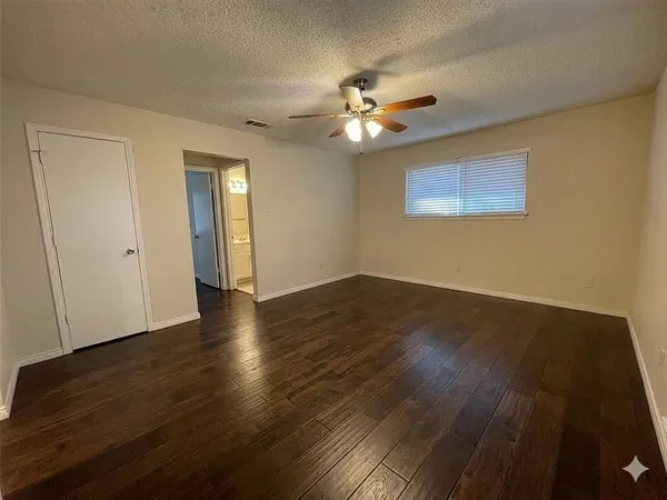 a bathroom with a toilet and a bathtub
