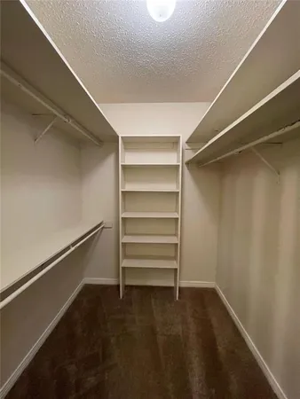 a spacious bathroom with a double vanity sink and mirror