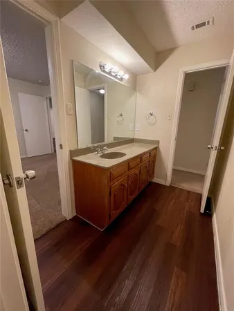 a white toilet sitting next to a bath tub
