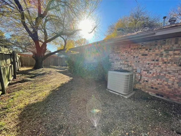a view of a yard with a tree