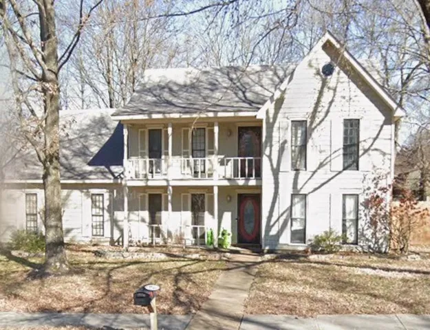 a front view of a building with street view