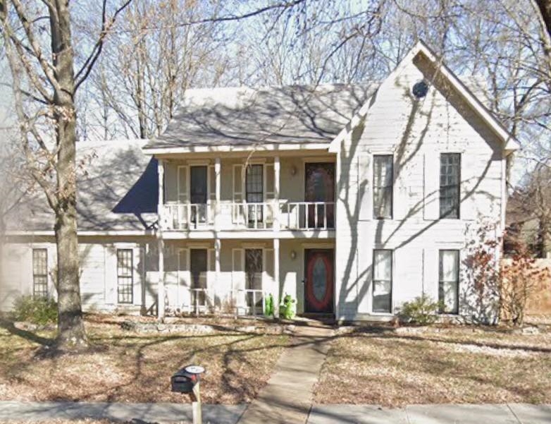 a front view of a building with street view