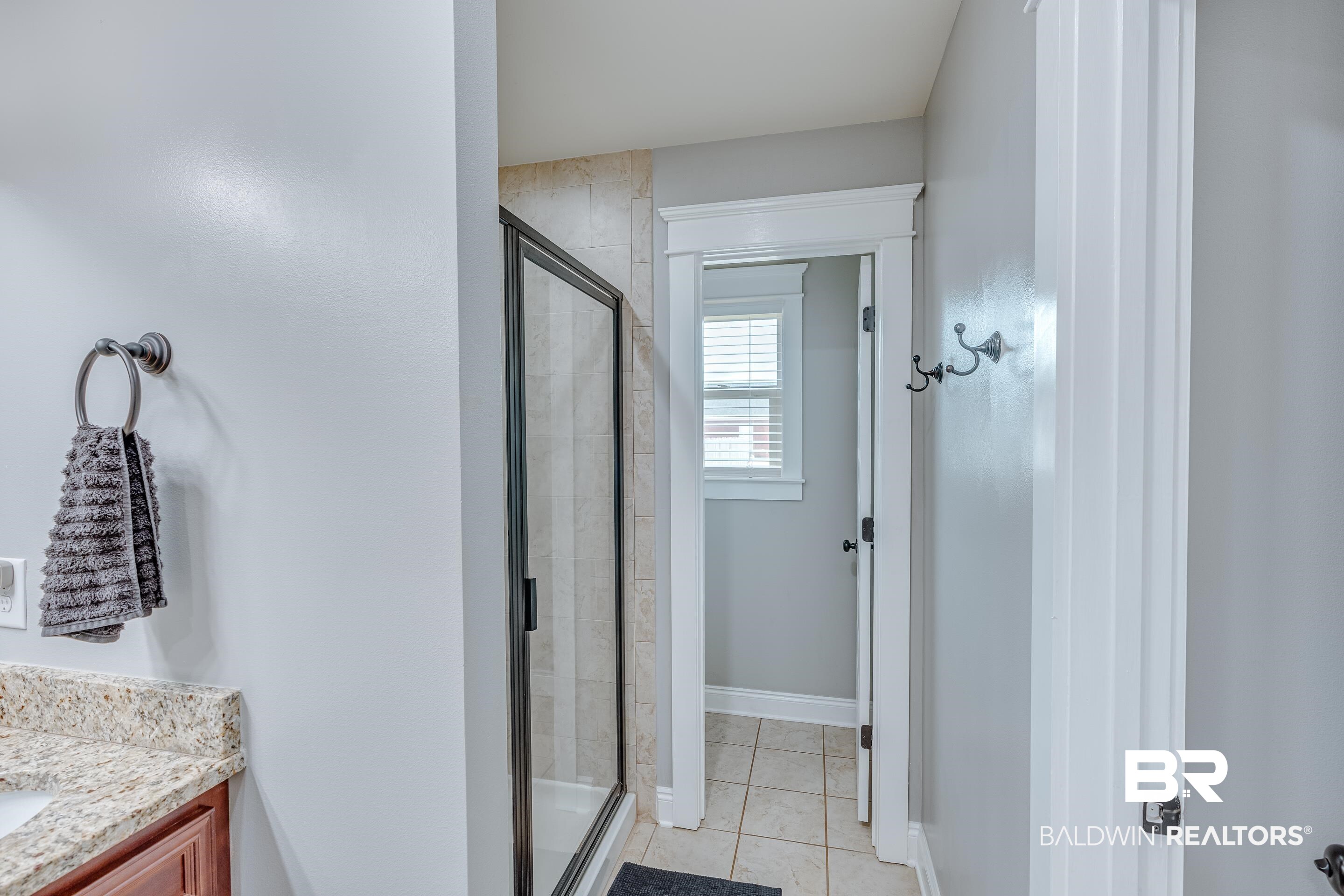 13235 Tom Gaston Road Mobile, AL 36695 - Photo 9 of 43 Bathroom with tile patterned flooring, vanity, and walk in shower
