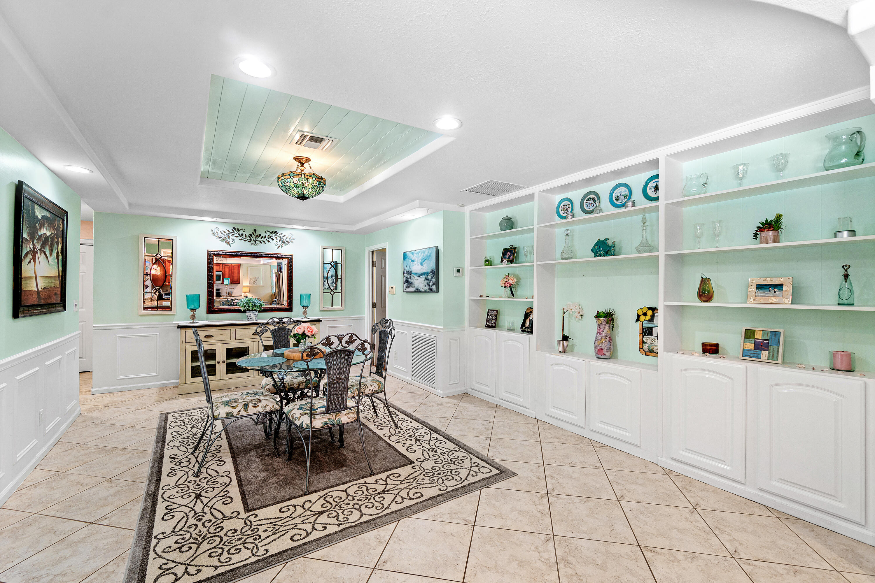 1108 Petrel Road Wellington, FL 33414 - Photo 18 of 46 a living room with furniture and a flat screen tv