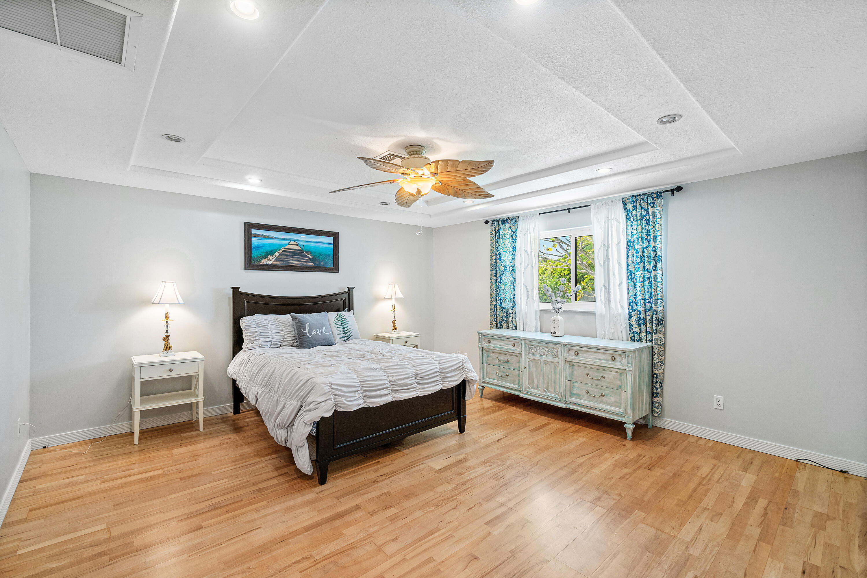 1108 Petrel Road Wellington, FL 33414 - Photo 21 of 46 a bedroom with a bed and a window