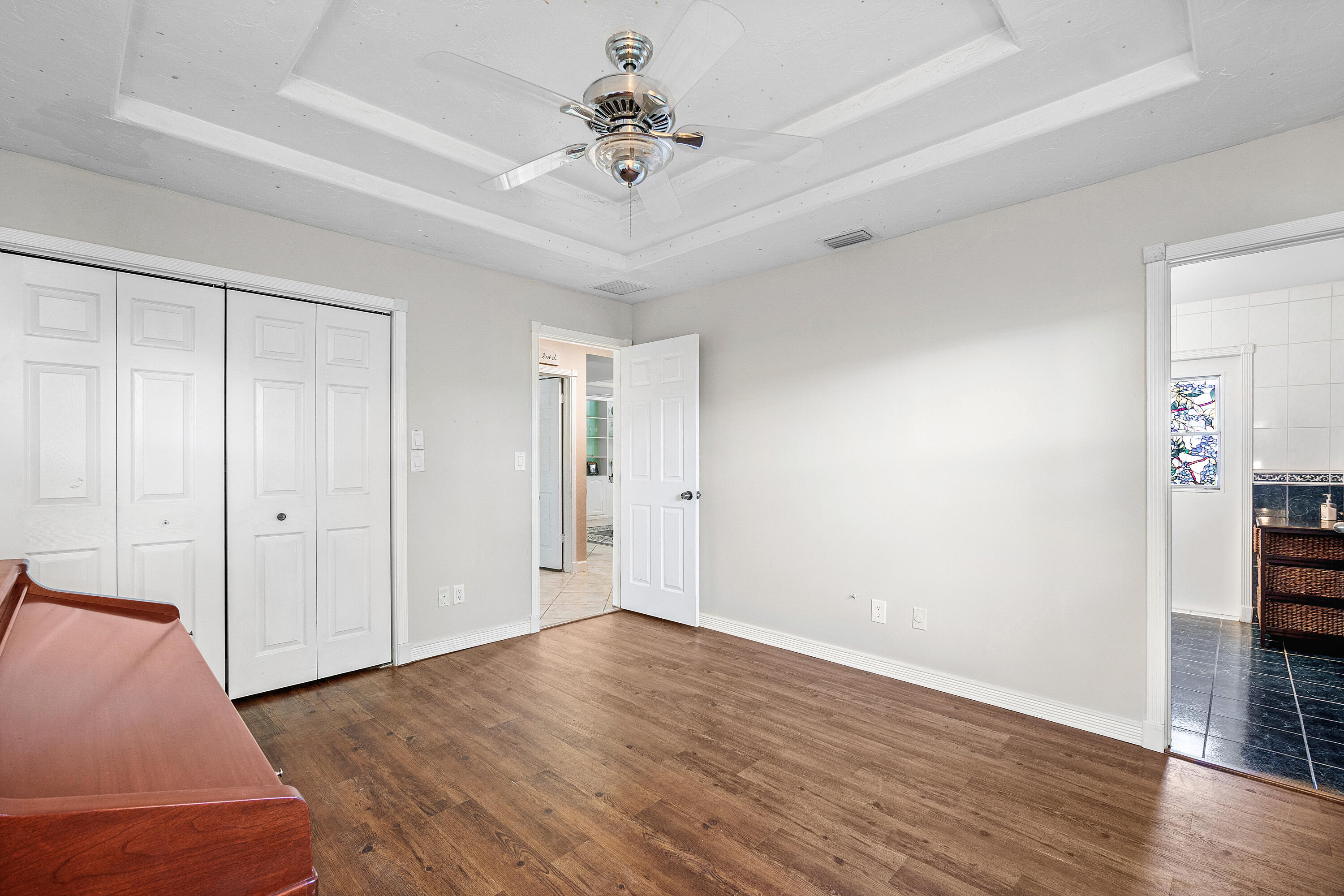 1108 Petrel Road Wellington, FL 33414 - Photo 36 of 46 a view of an empty room with wooden floor