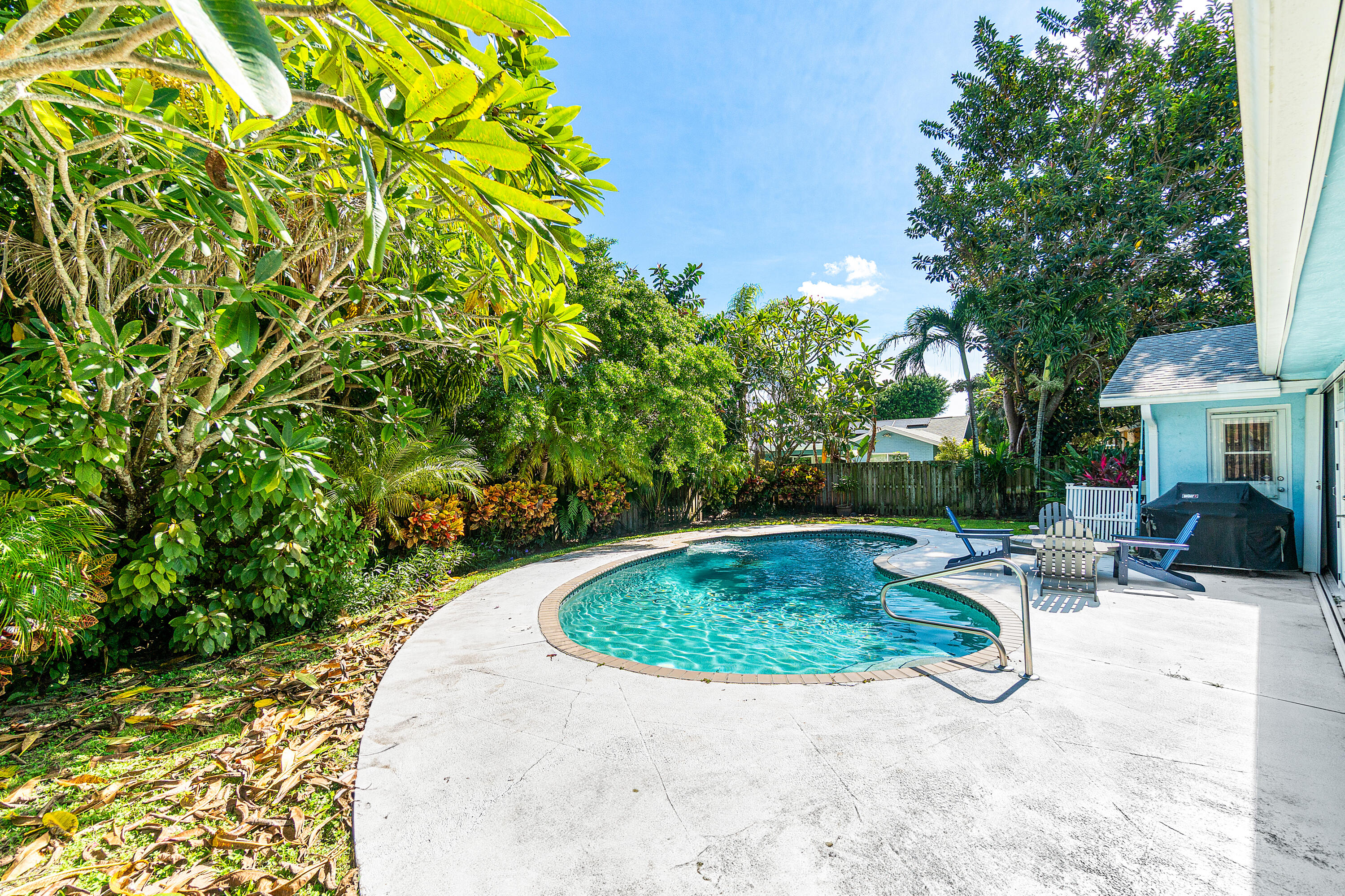 1108 Petrel Road Wellington, FL 33414 - Photo 42 of 46 a view of a swimming pool with a patio