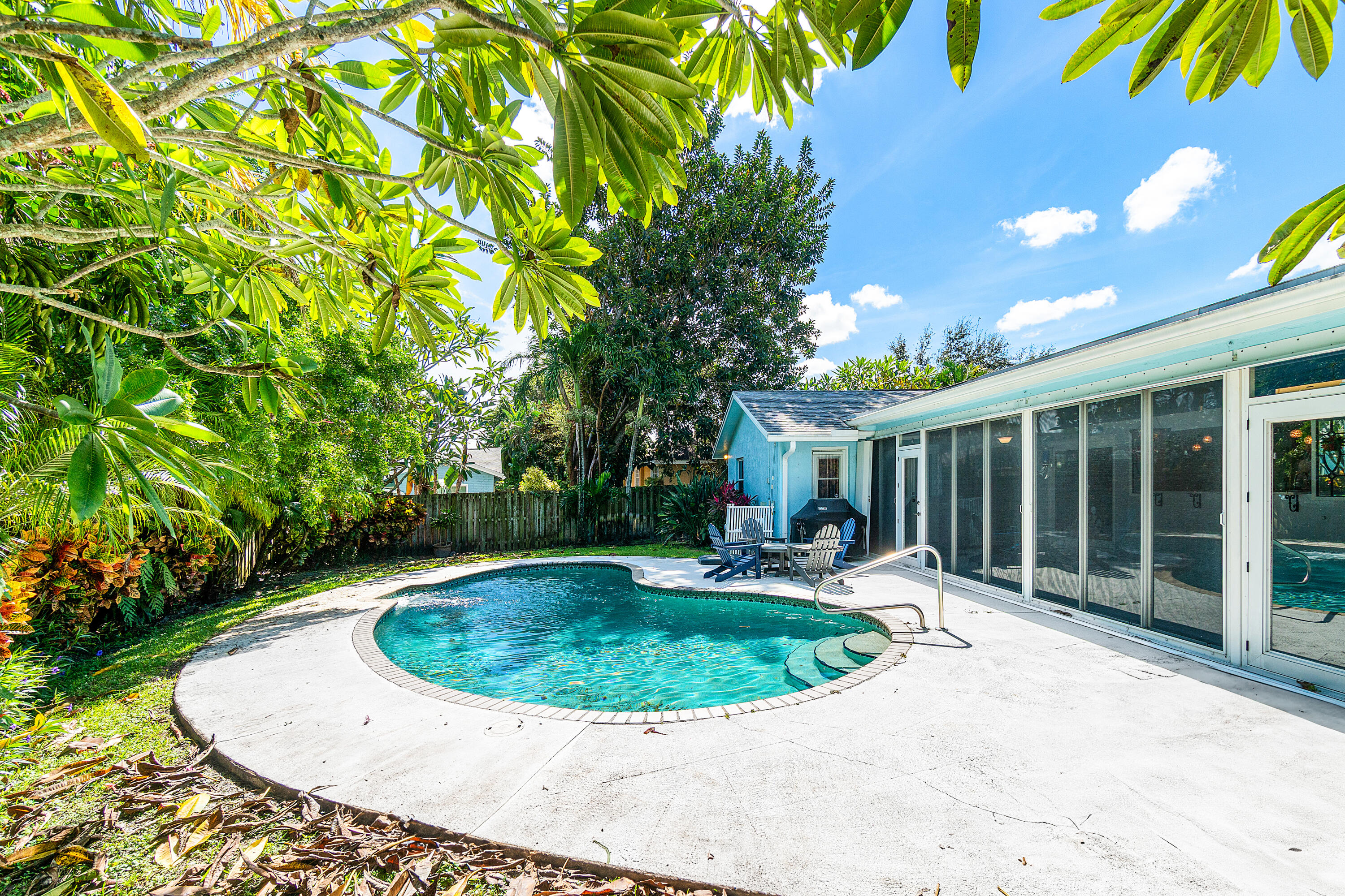 1108 Petrel Road Wellington, FL 33414 - Photo 43 of 46 a view of a house with a backyard and porch