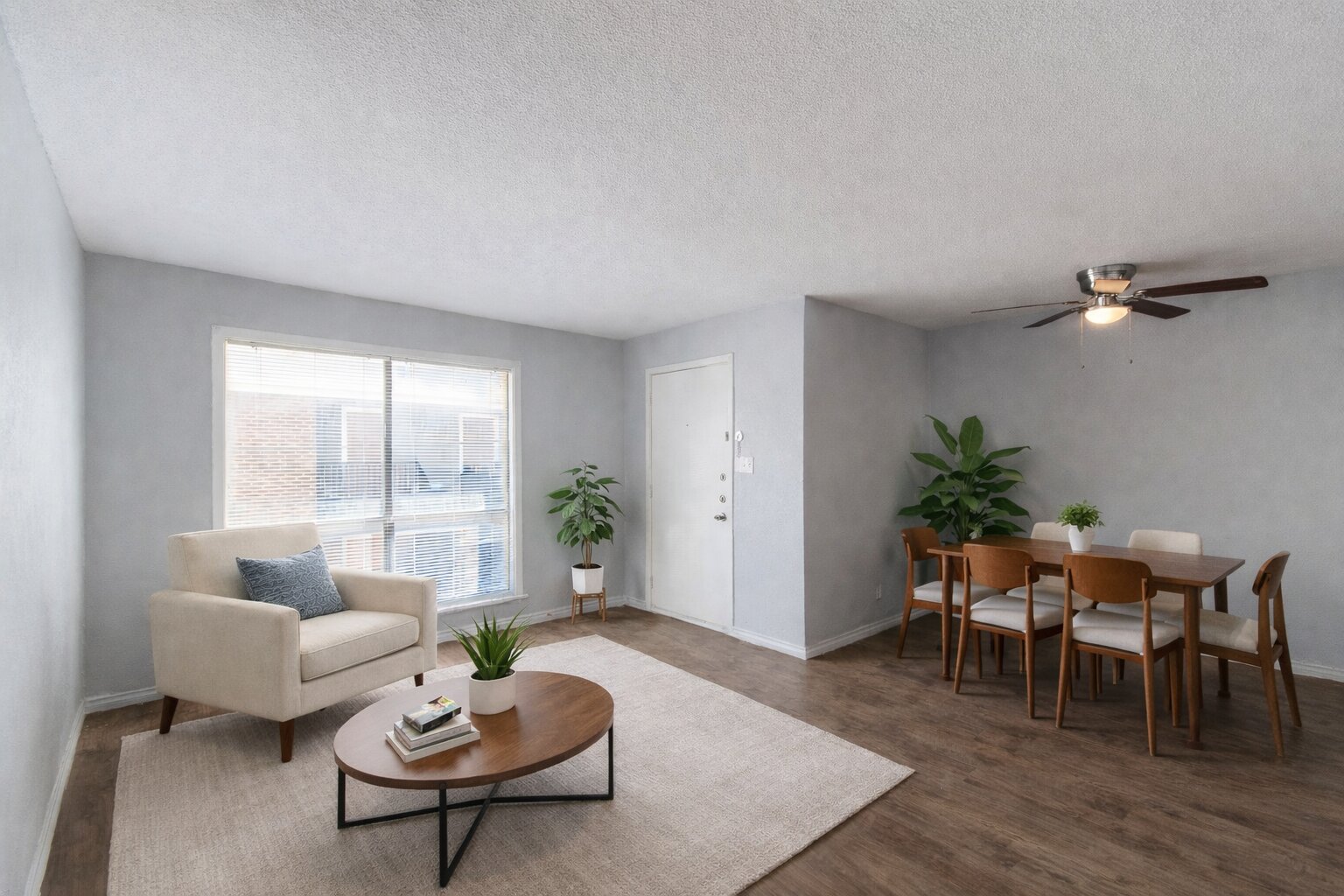 100 Uhland Road, Unit 3 San Marcos, TX 78666 - Photo 4 of 24 Living area with a textured ceiling, a ceiling fan, and wood finished floors