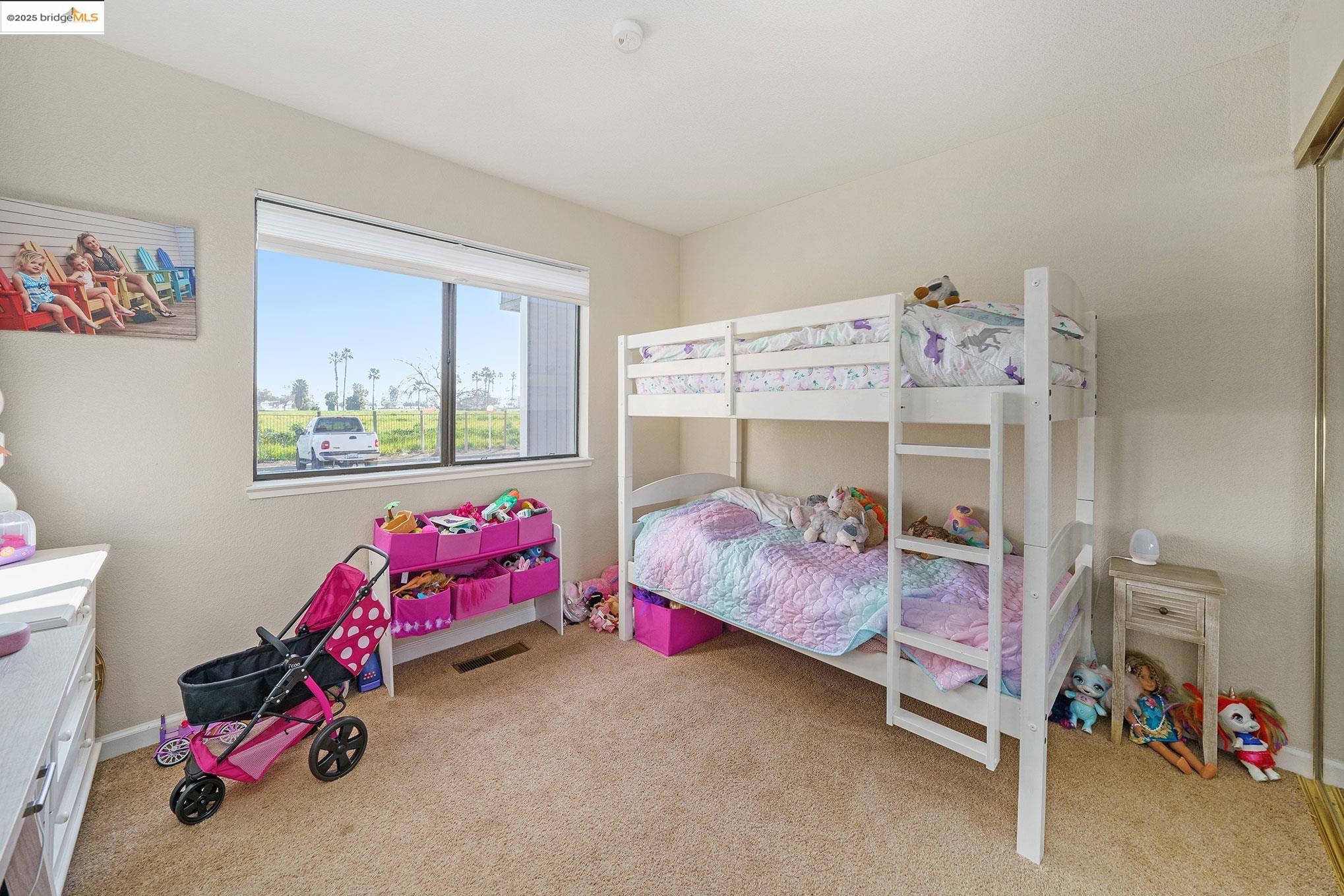 2013 Sand Point Road Discovery Bay, CA 94505 - Photo 12 of 28 a bedroom with a bed and a chair