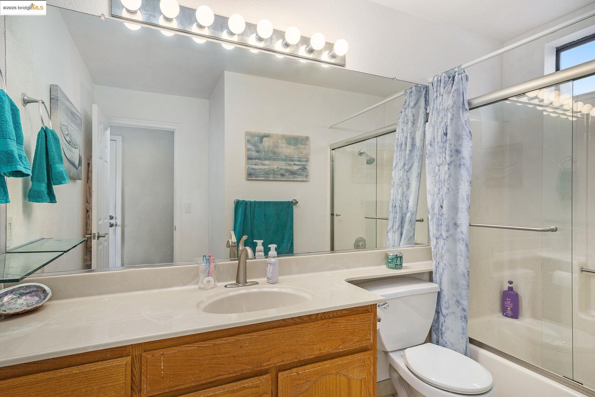 2013 Sand Point Road Discovery Bay, CA 94505 - Photo 13 of 28 a bathroom with a sink toilet and shower