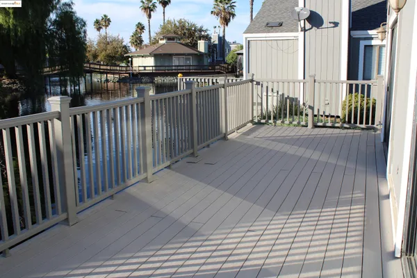 a view of a balcony with wooden floor