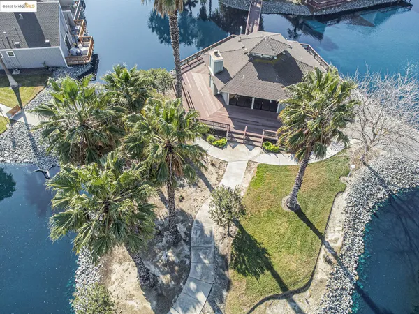 an aerial view of a house with a table and chairs