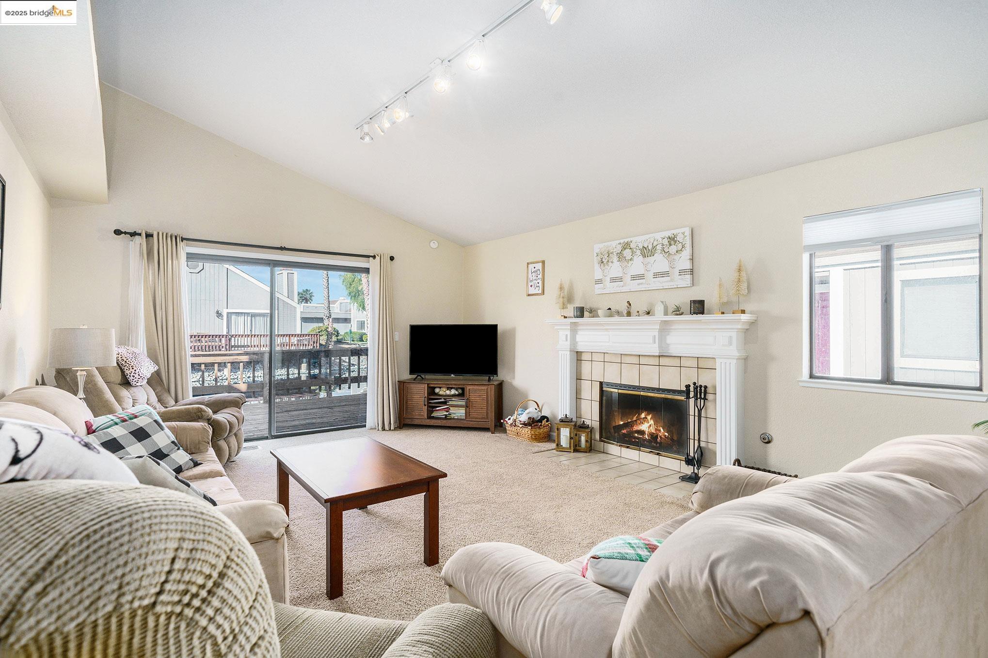 2013 Sand Point Road Discovery Bay, CA 94505 - Photo 5 of 28 a living room with furniture fireplace and flat screen tv