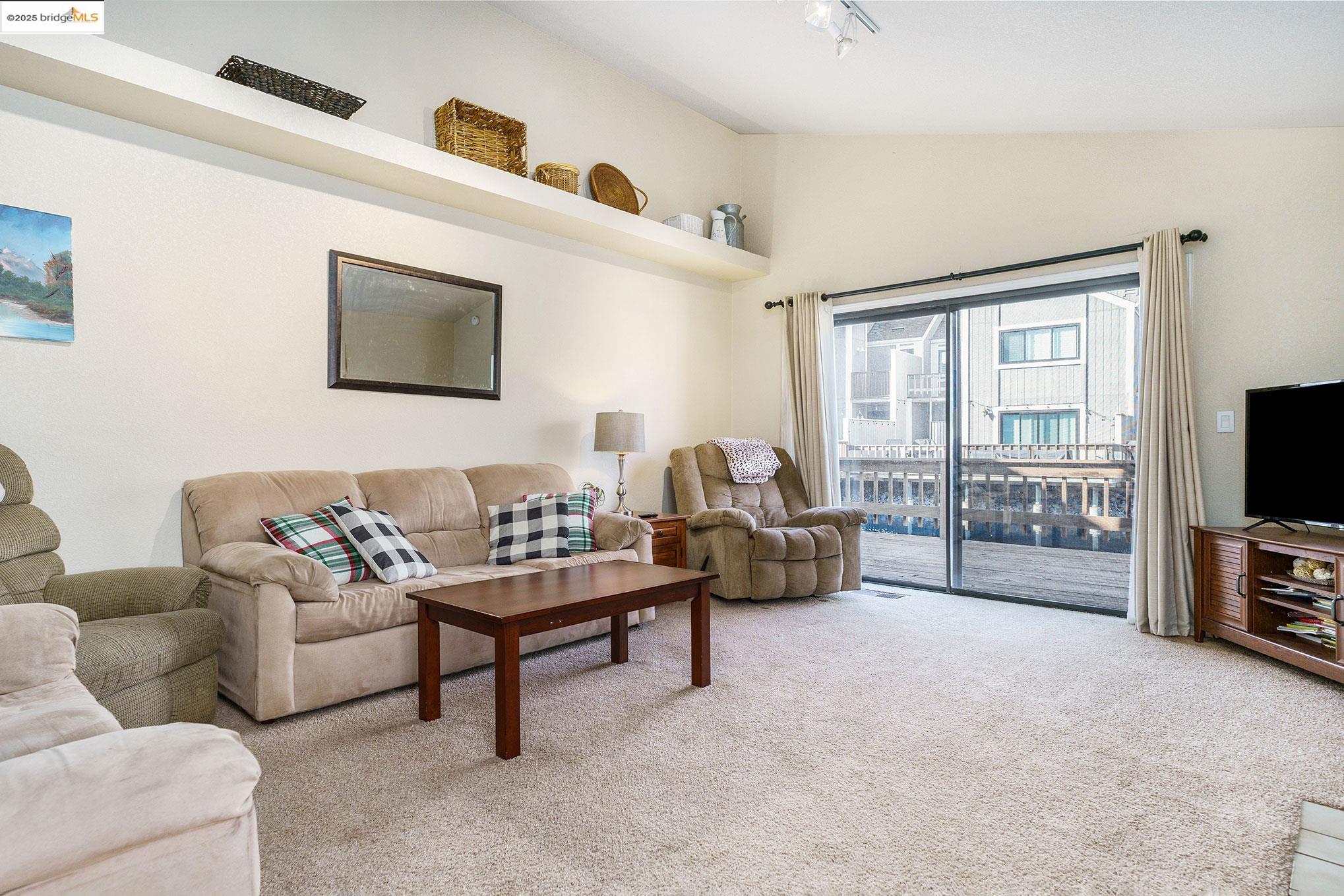 2013 Sand Point Road Discovery Bay, CA 94505 - Photo 6 of 28 a living room with furniture and a flat screen tv