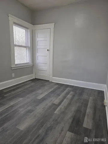 a kitchen with cabinets and stainless steel appliances