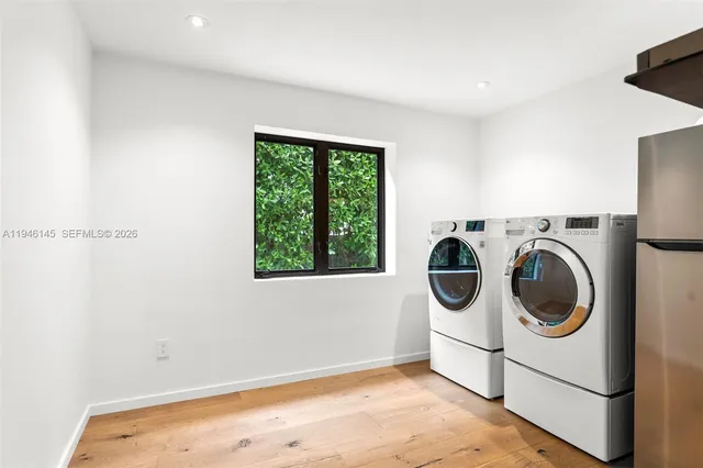 a utility room with dryer and washer