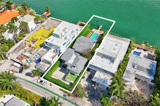 an aerial view of residential house with outdoor space and parking