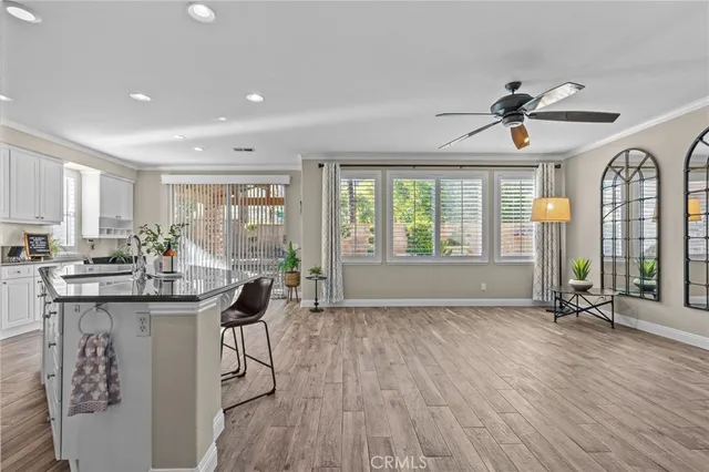 a view of a livingroom with furniture window and wooden floor