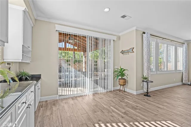 a view of an entryway with wooden floor