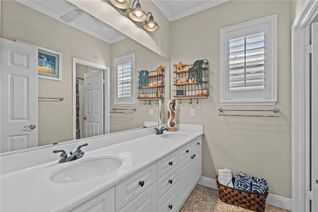 a bathroom with a sink double vanity and a mirror