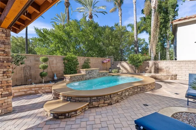 a view of a patio with a table and chairs