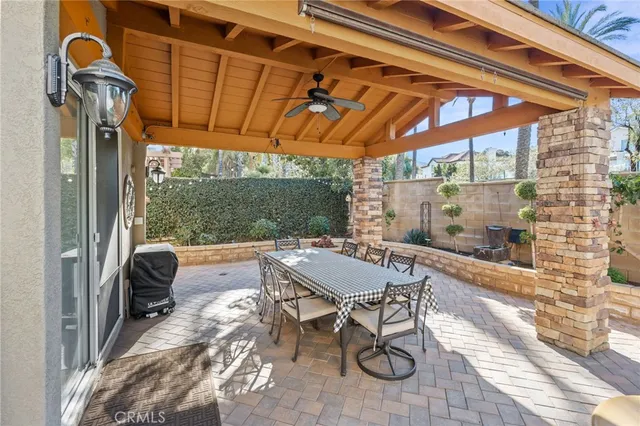 a view of a patio with a table and chairs
