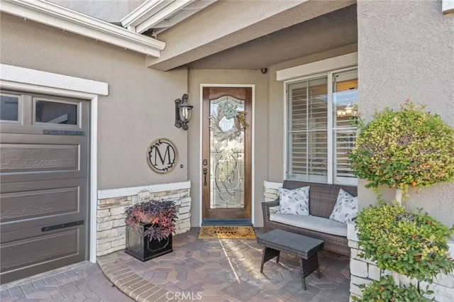 a building outdoor space with patio furniture and potted plants
