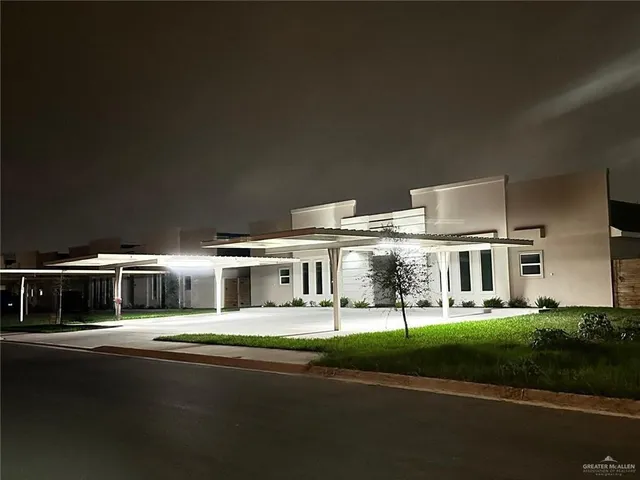 a view of house with yard and green space