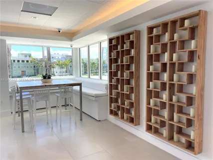 a room with a workspace and a window