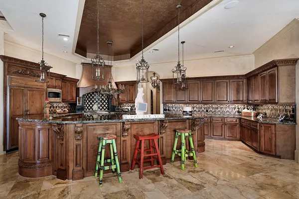 a kitchen with a stove and cabinets