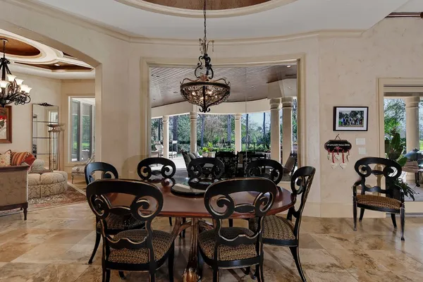 a view of a dining room with furniture window and outside view