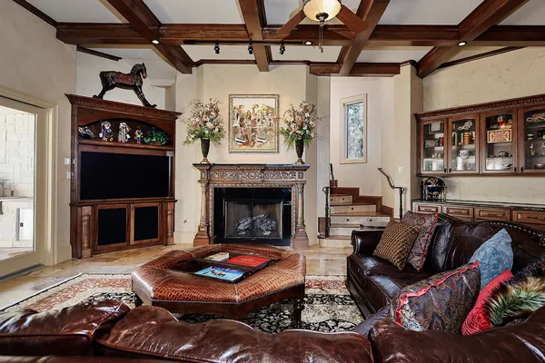 a bedroom with a bed and a fireplace