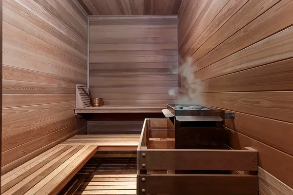 a dining room with furniture and a potted plant