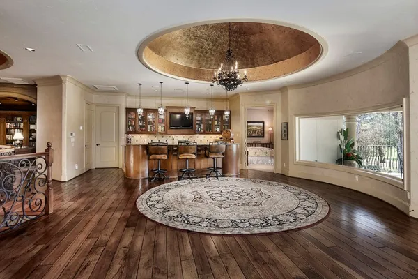 a room with lots of furniture and a rug