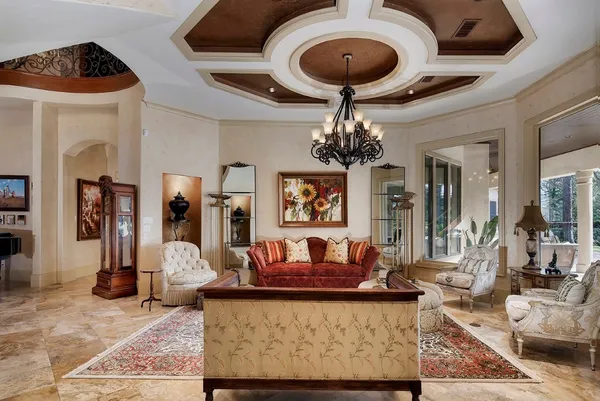 a view of a livingroom with furniture and a window
