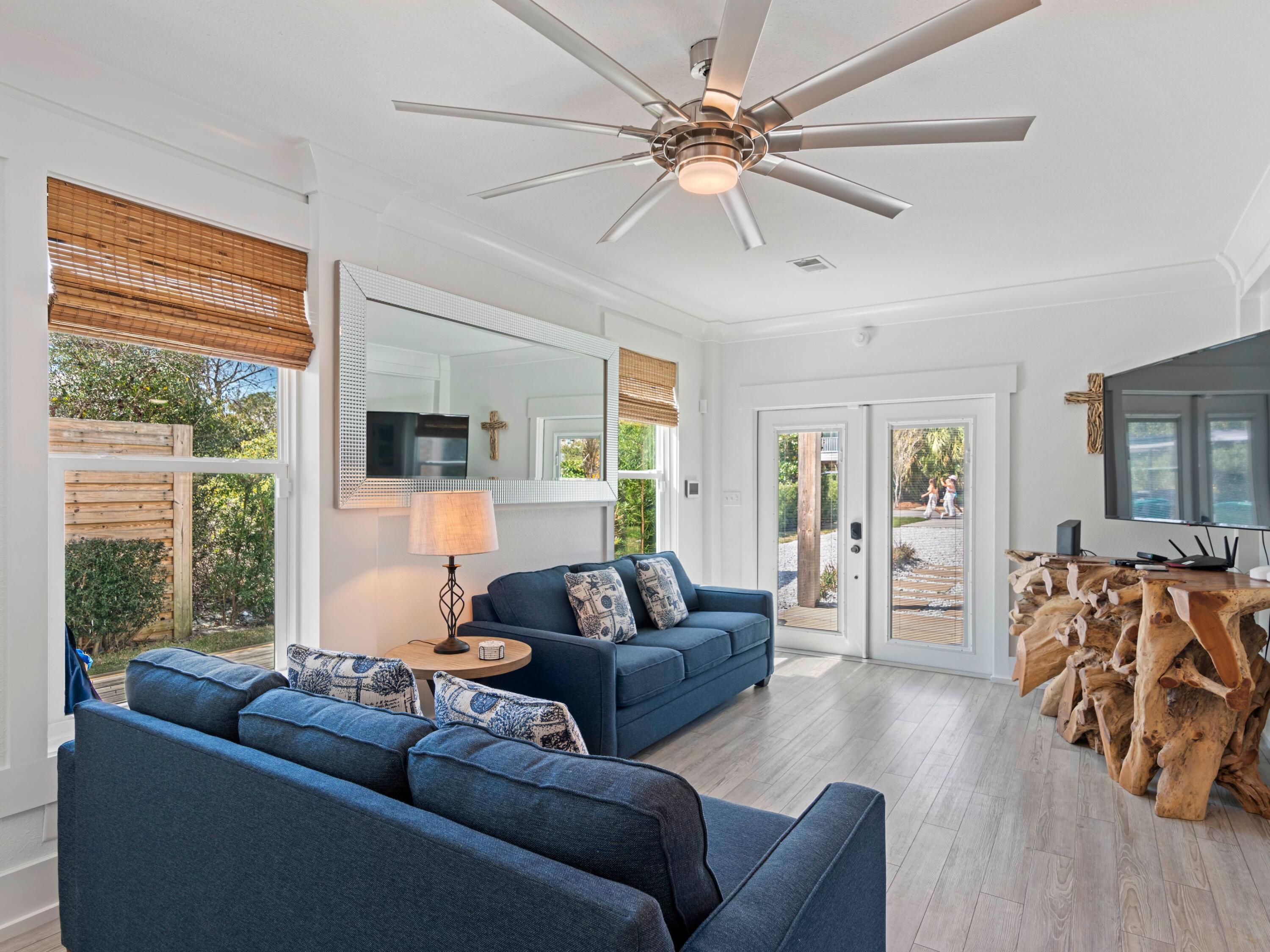 89 Tarpon Street Destin, FL 32541 - Photo 2 of 53 a living room with furniture and a large window
