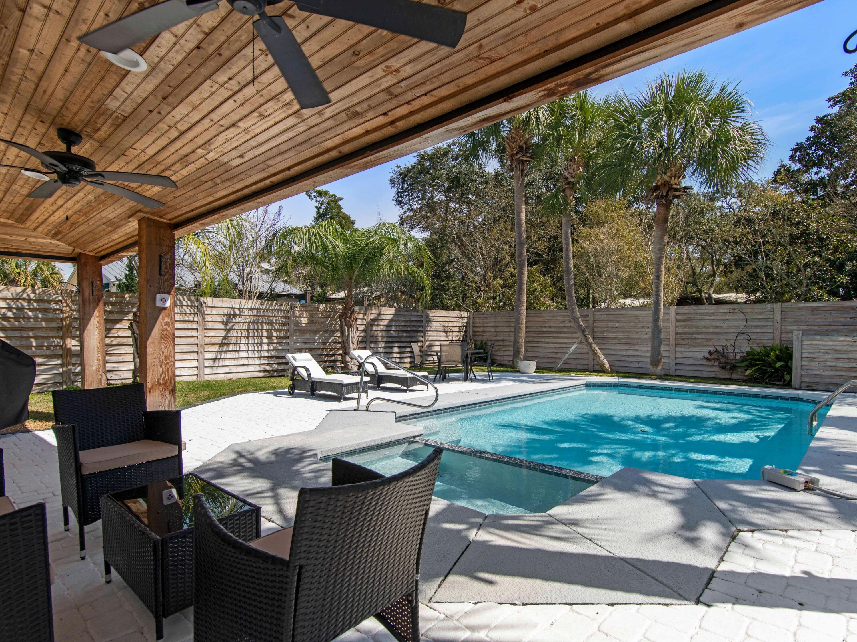 89 Tarpon Street Destin, FL 32541 - Photo 22 of 53 a view of backyard with seating space