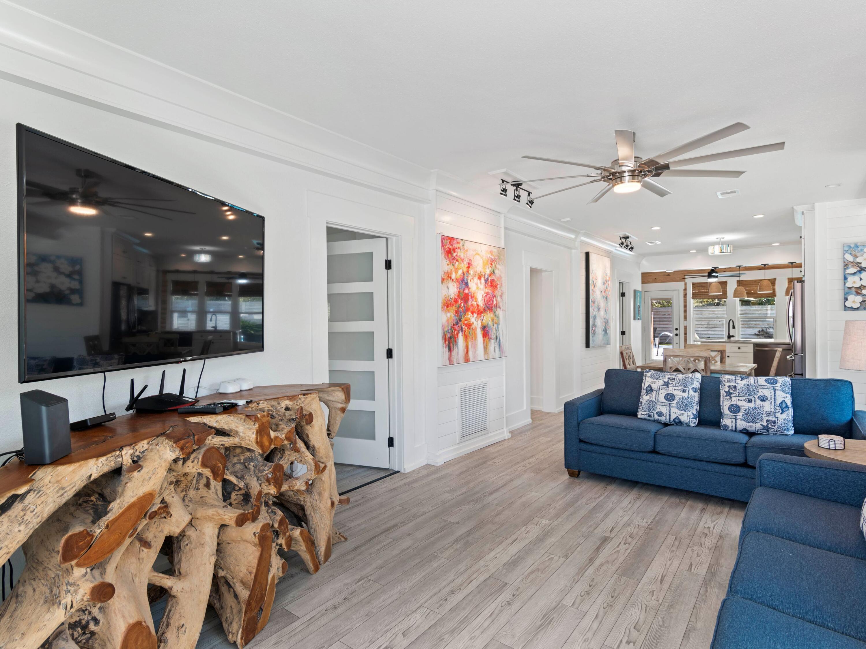 89 Tarpon Street Destin, FL 32541 - Photo 27 of 53 a living room with furniture and a flat screen tv