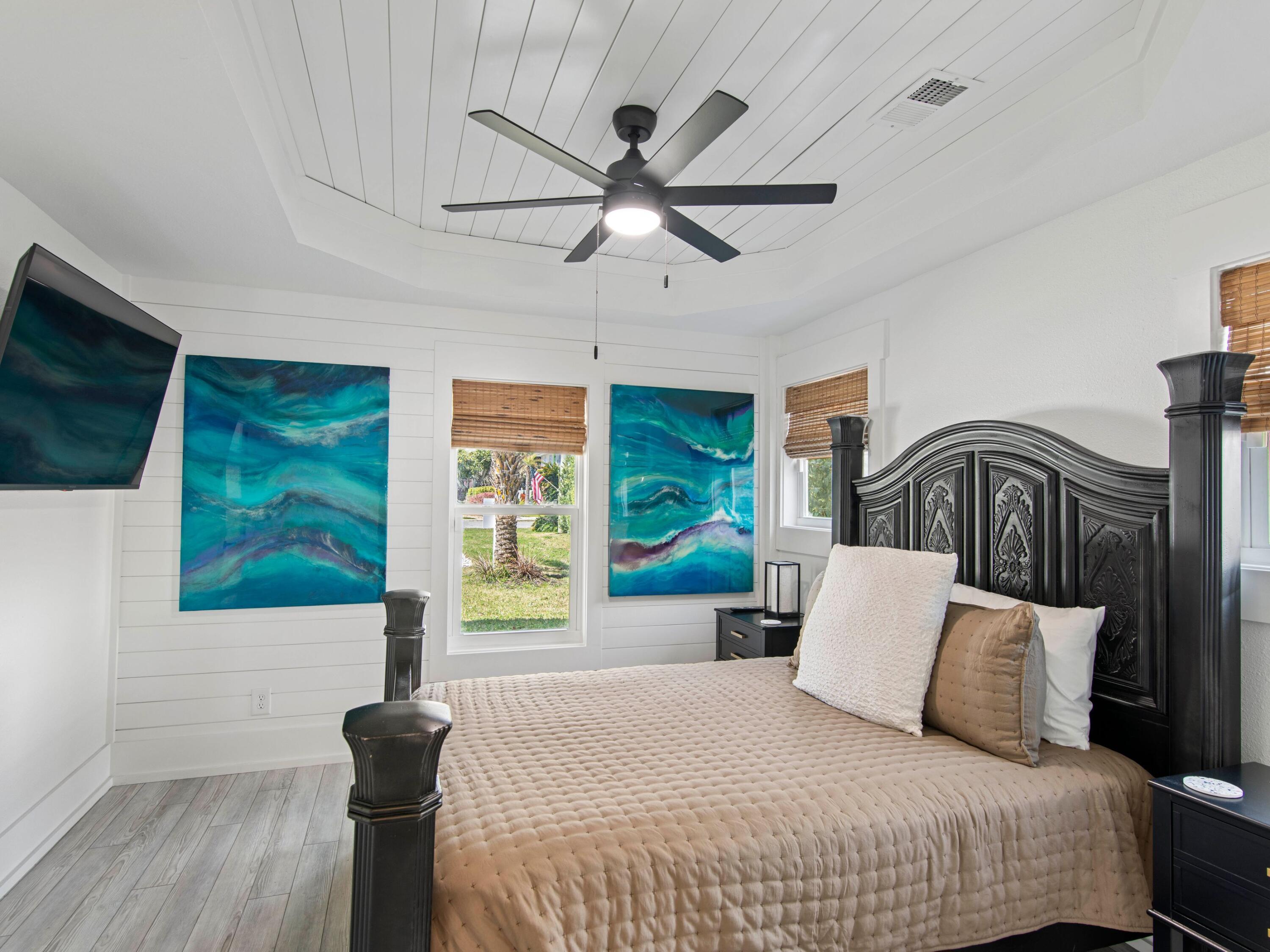 89 Tarpon Street Destin, FL 32541 - Photo 35 of 53 a bedroom with a bed and a flat tv screen
