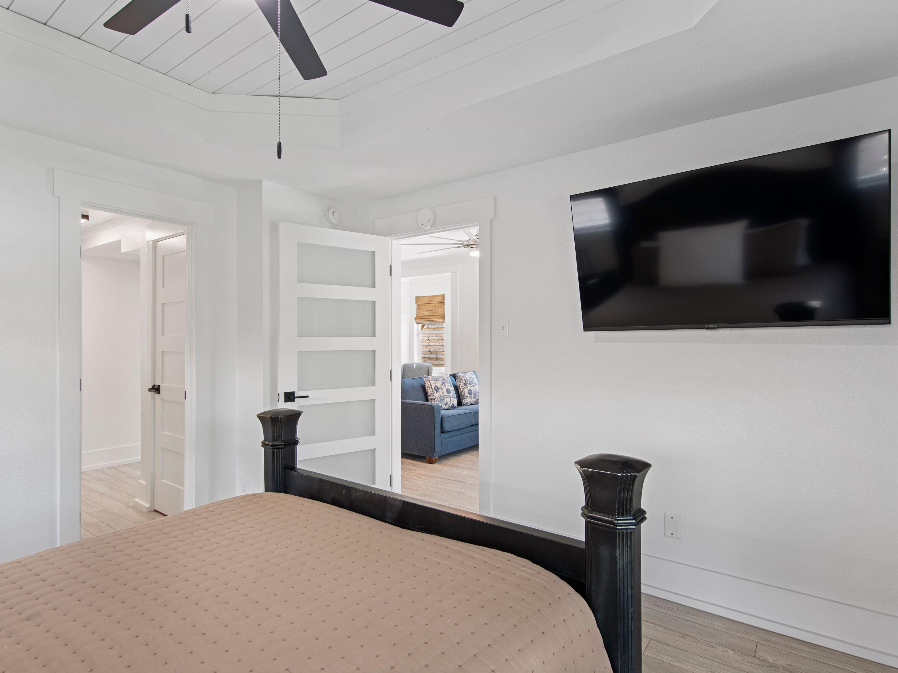 89 Tarpon Street Destin, FL 32541 - Photo 36 of 53 a bedroom with a bed and a flat tv screen