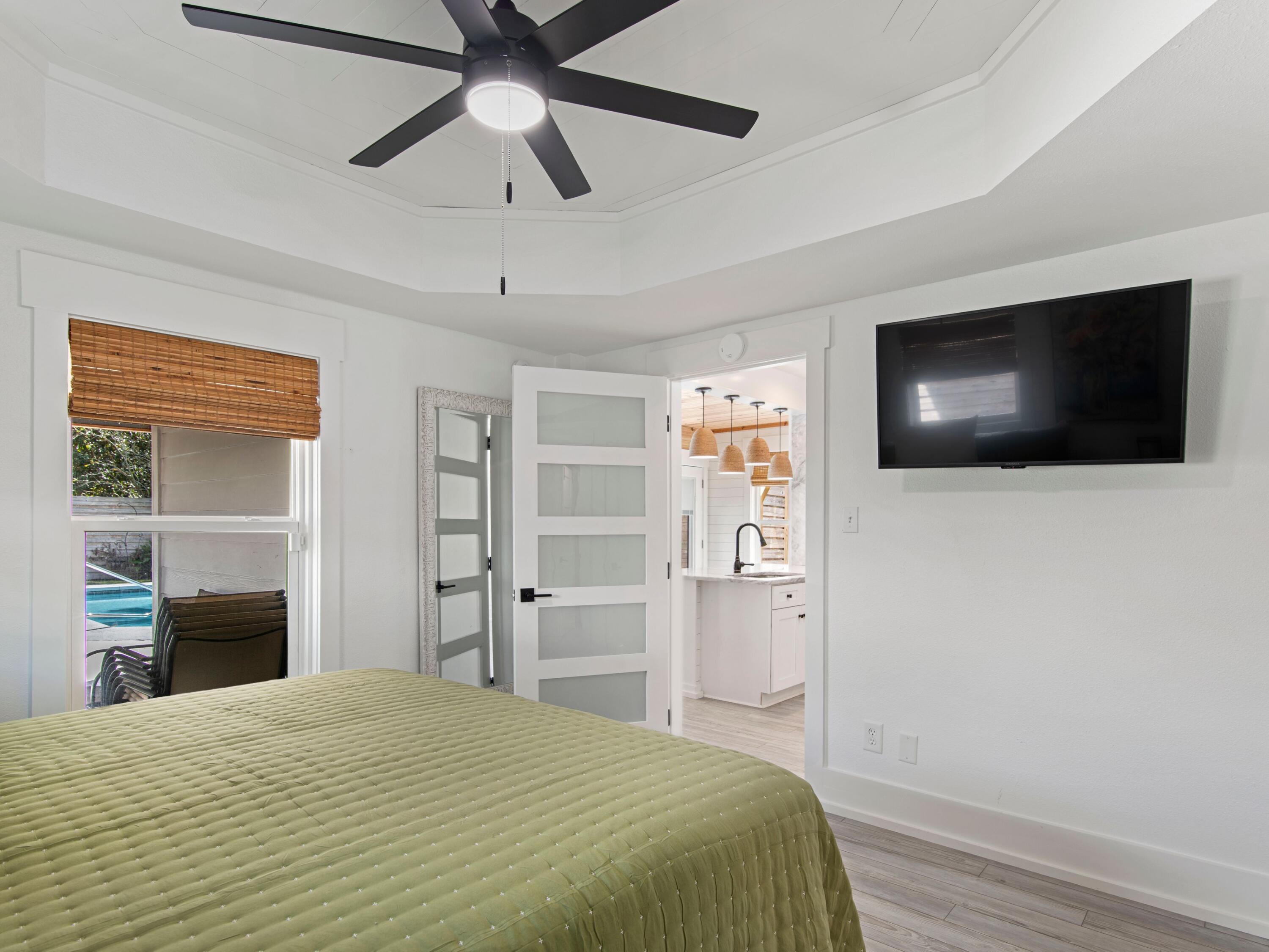 89 Tarpon Street Destin, FL 32541 - Photo 38 of 53 a bedroom with a bed and a flat screen tv