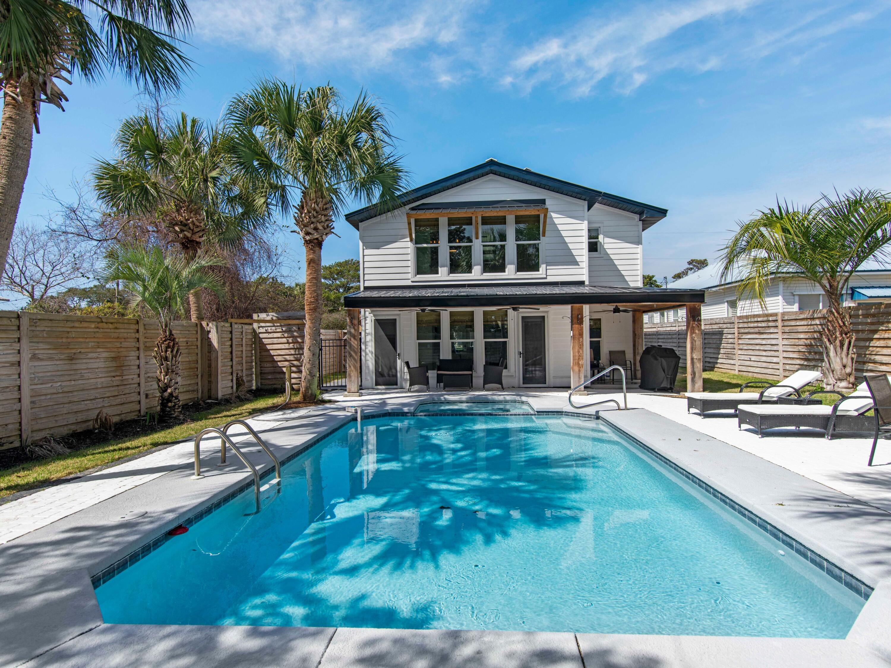 89 Tarpon Street Destin, FL 32541 - Photo 4 of 53 a view of a house with pool and sitting area