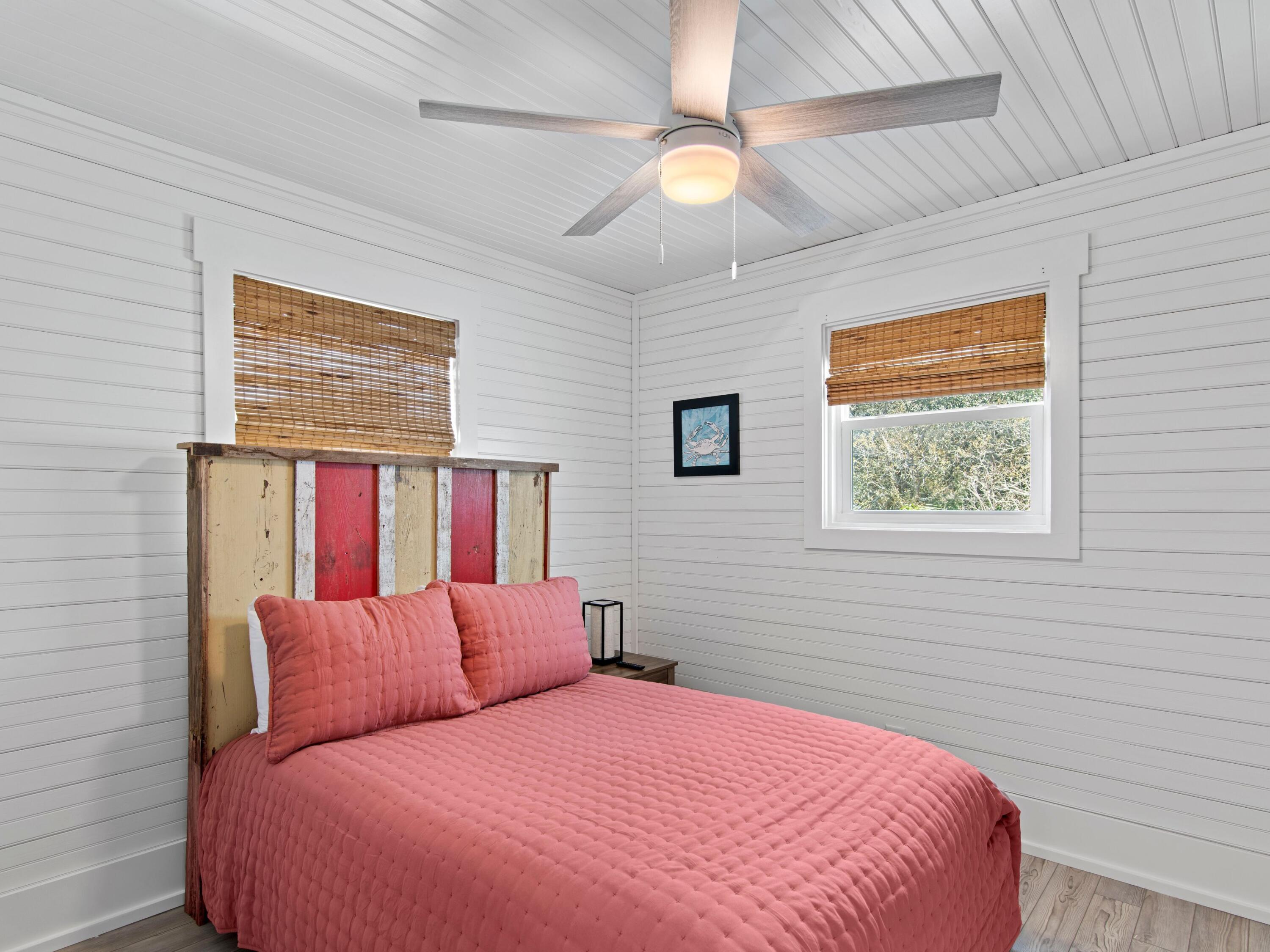 89 Tarpon Street Destin, FL 32541 - Photo 47 of 53 a bedroom with a large bed and a window