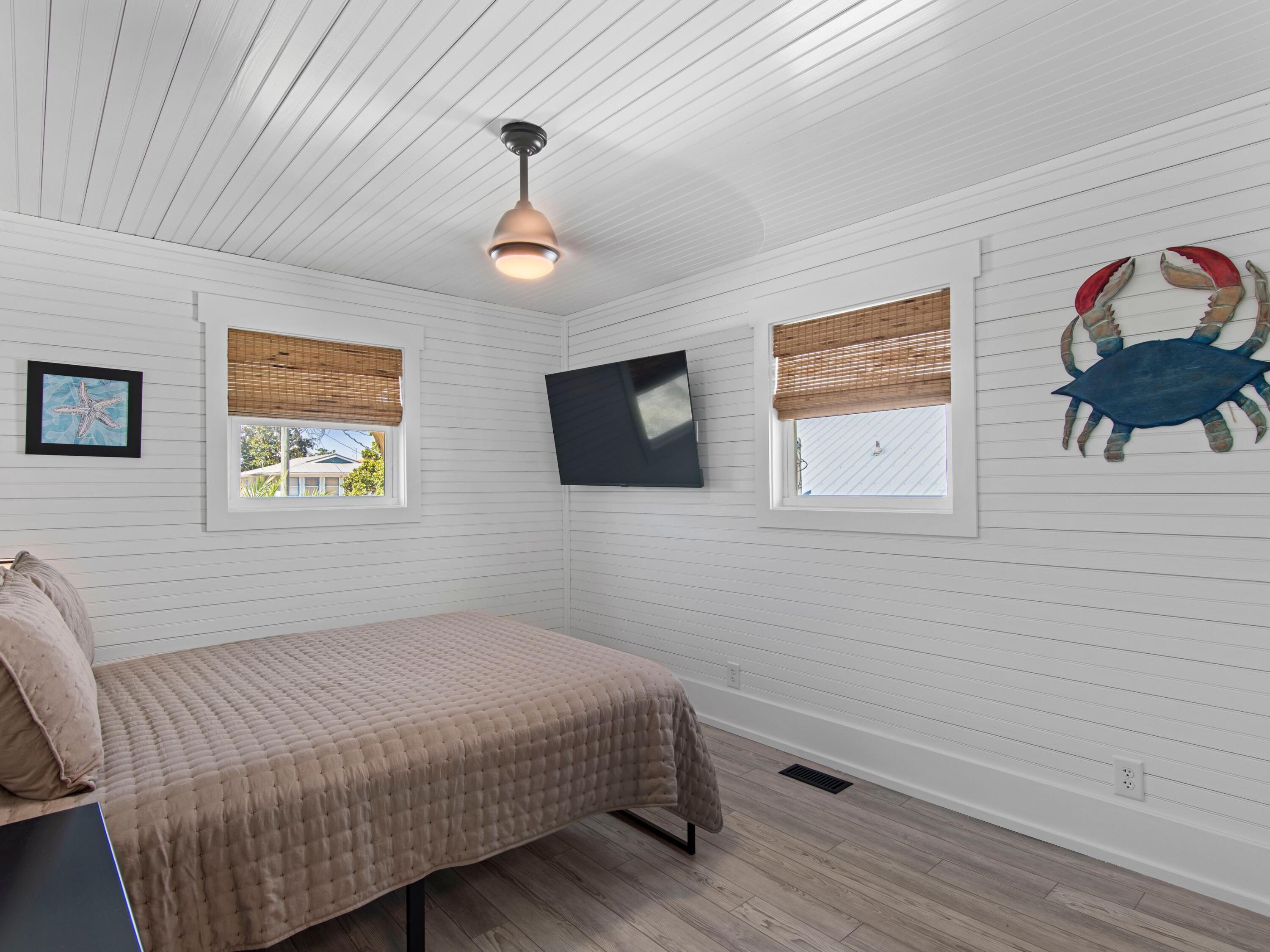 89 Tarpon Street Destin, FL 32541 - Photo 50 of 53 a bedroom with a bed and a painting on the wall